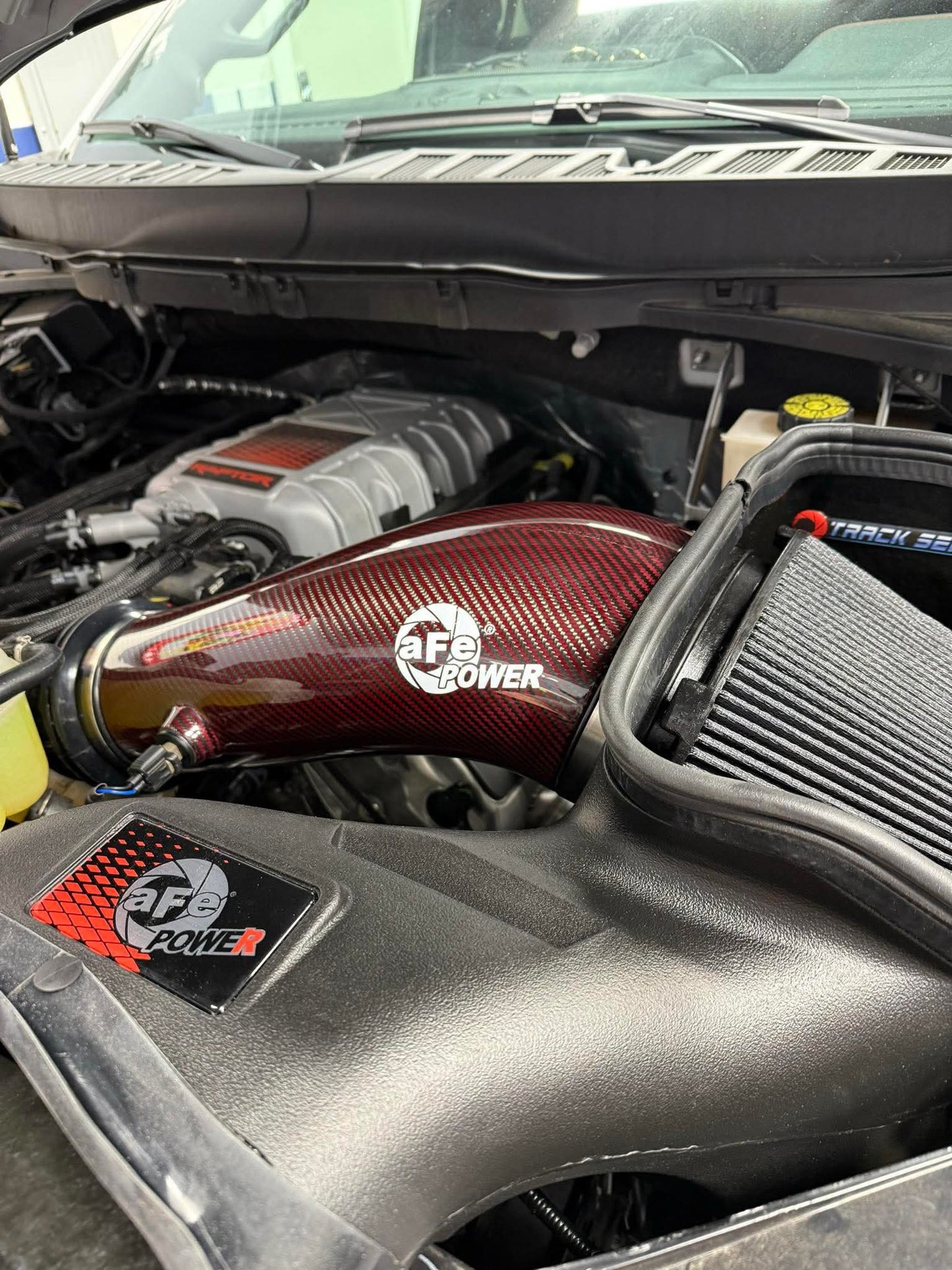 AFE 23-24 Ford F150 Raptor R V8 5.2L Supercharged Red Carbon Track Series Air Intake w/ P5R Filter