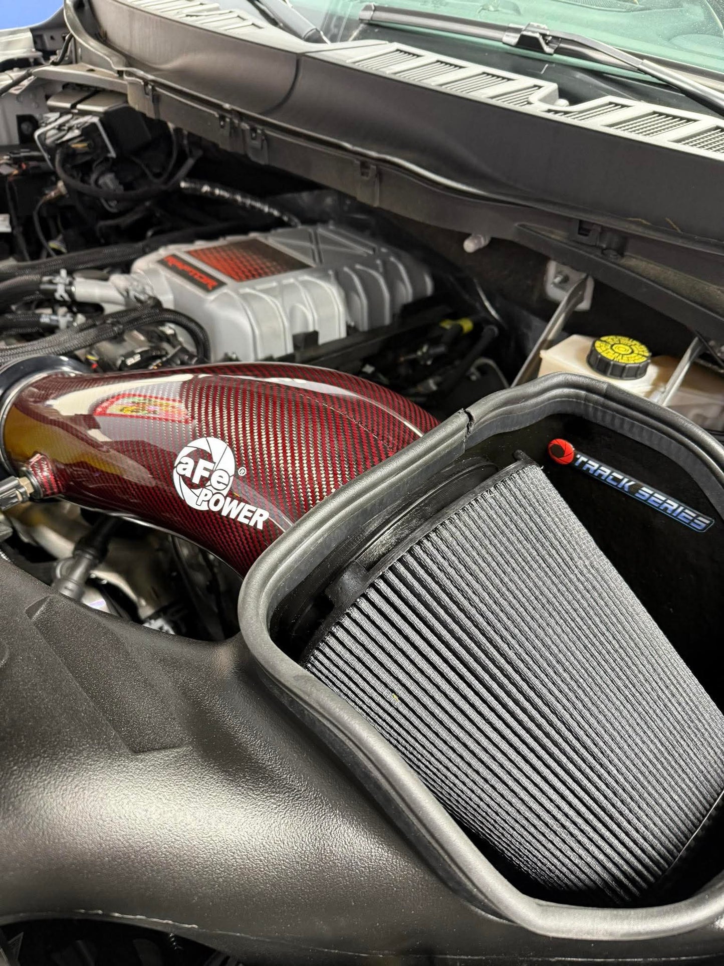 AFE 23-24 Ford F150 Raptor R V8 5.2L Supercharged Red Carbon Track Series Air Intake w/ P5R Filter